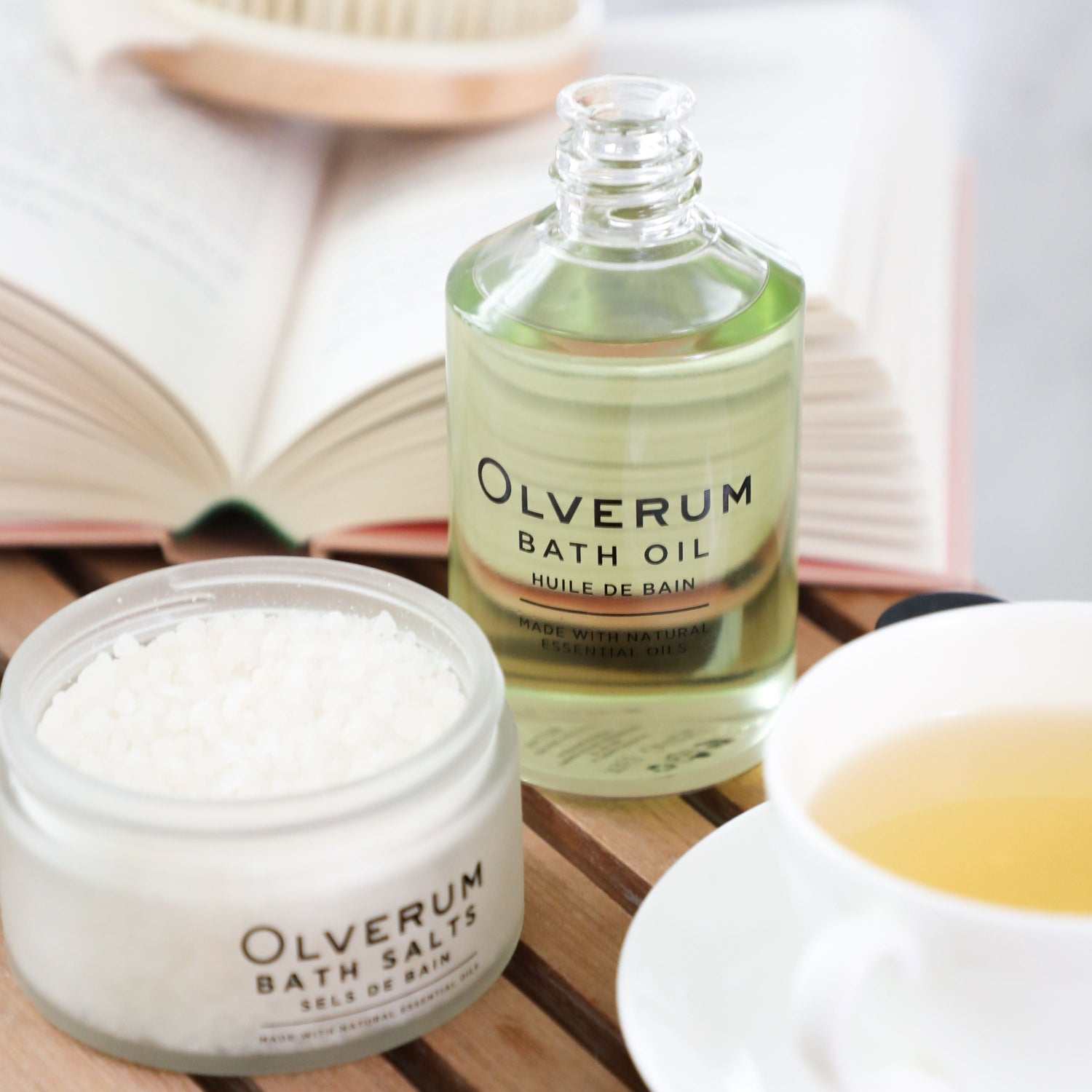 bottle-olverum-bath-oil-bath-salts-with-open-book-cup-of-tea