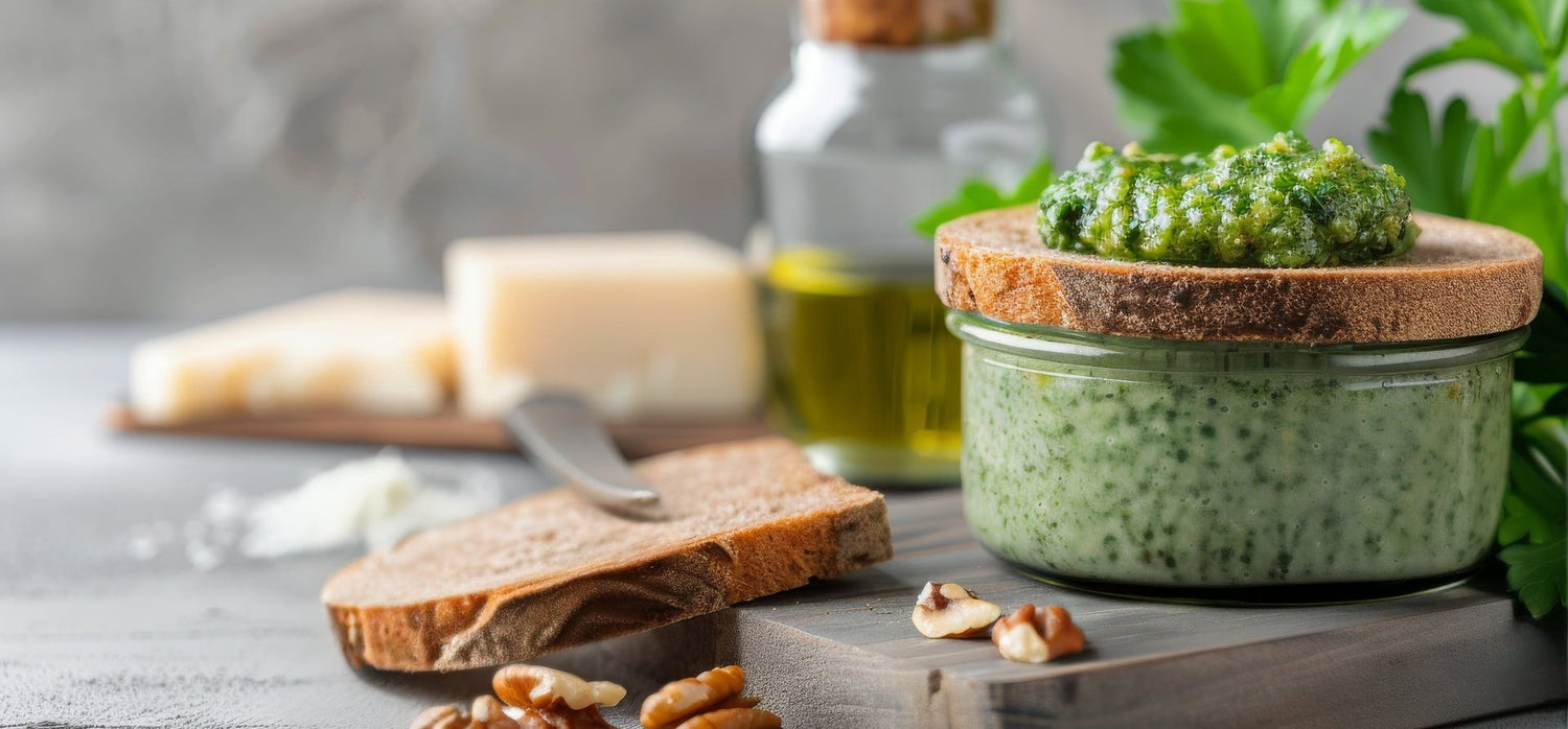 Image-of-bread-oil-and-pesto-on-board-with-nuts-and-cheese