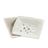 White ceramic soap dish with a grid pattern on a white background