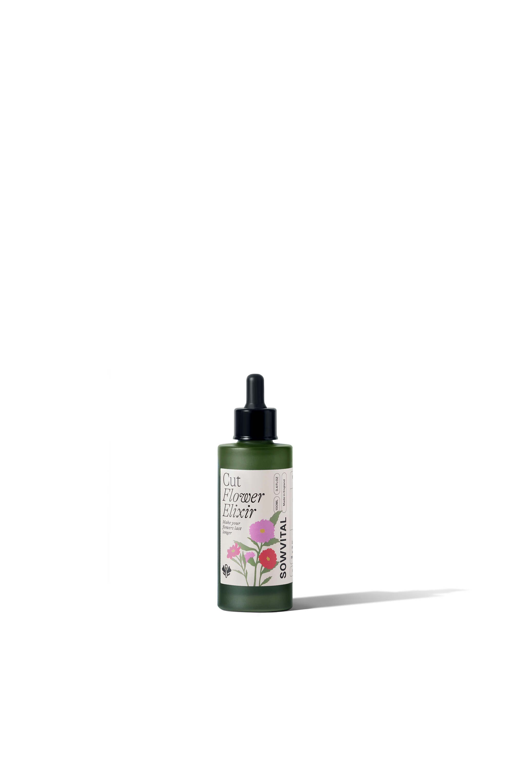 Green bottle with floral design on a white background