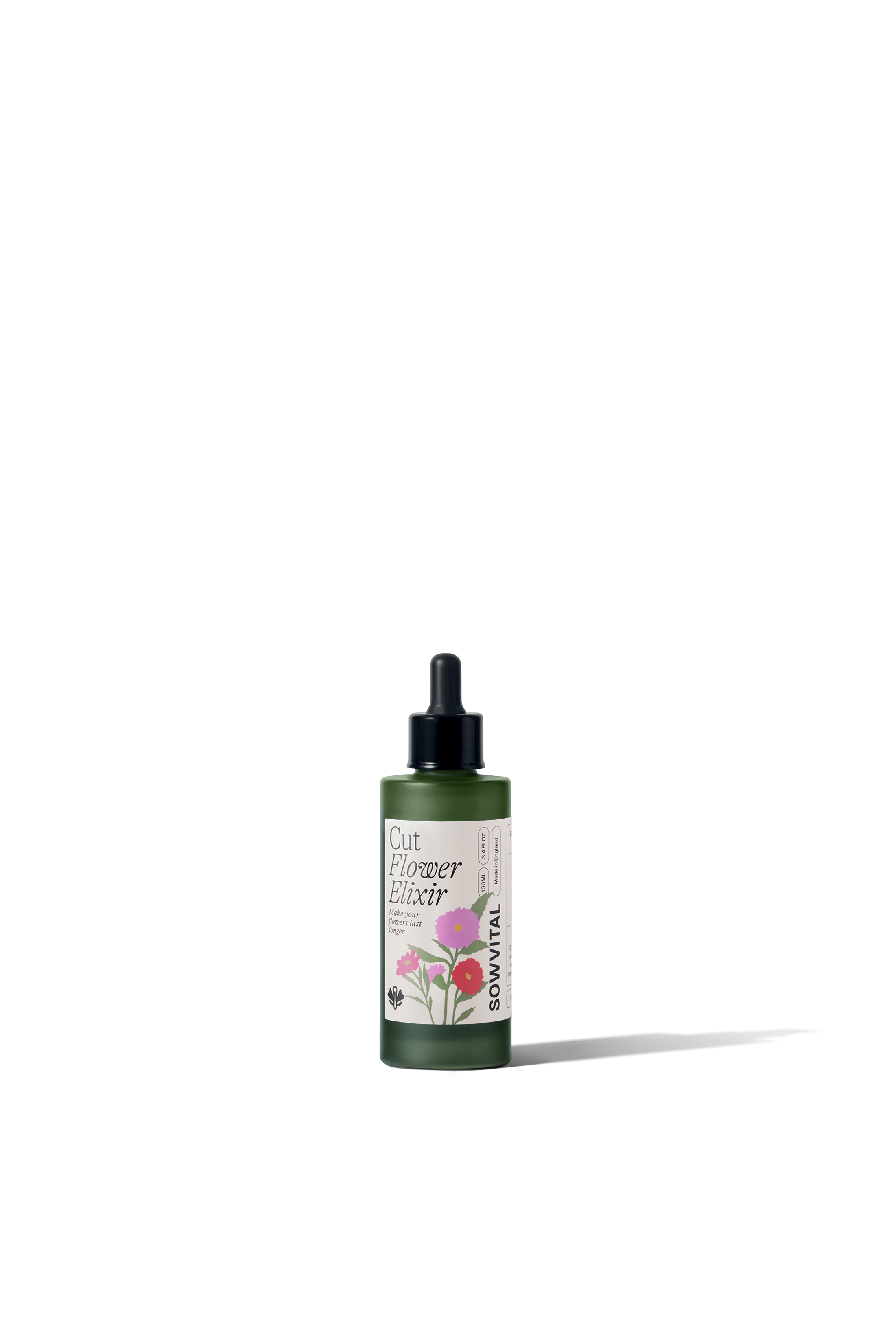 Green bottle with floral design on a white background