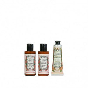 Three bottles of body care products on a white background