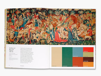 Book open to a page with a tapestry reproduction and color swatches