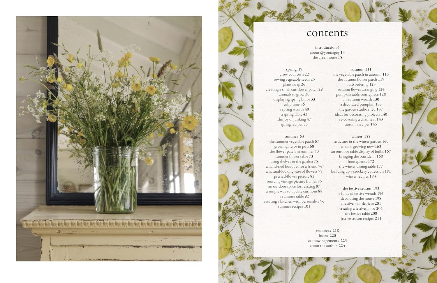 An open book or magazine spread showing a printed table of contents page on the right with floral border decoration, and a photograph of white flowers in a vase on a shelf on the left.
