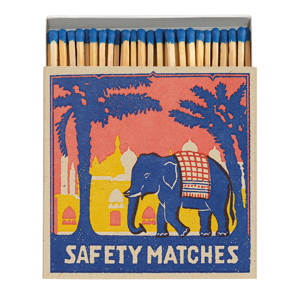 Matchbox open with blue elephant and tree with safety match written on bottom of-image