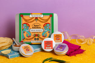 Spice Kitchen Indian Banquet kit with various spice containers on a yellow and purple background