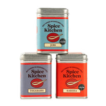 Three Spice Kitchen spice tins with different flavors on a white background