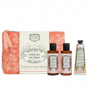 Set of skincare products including a bag, bottles, and a tube on a white background