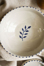 image-cream-glazed-bowl-on-natural-linen-cloth